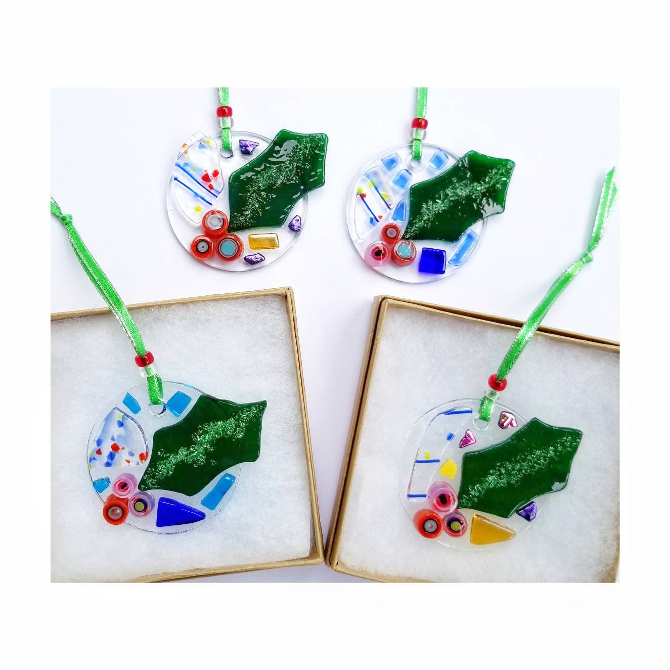 Fused Glass Holiday Ornaments, Gift Tags. Bright Colors with Red & Green Glass are kiln fired and melted onto a two inch clear circle.