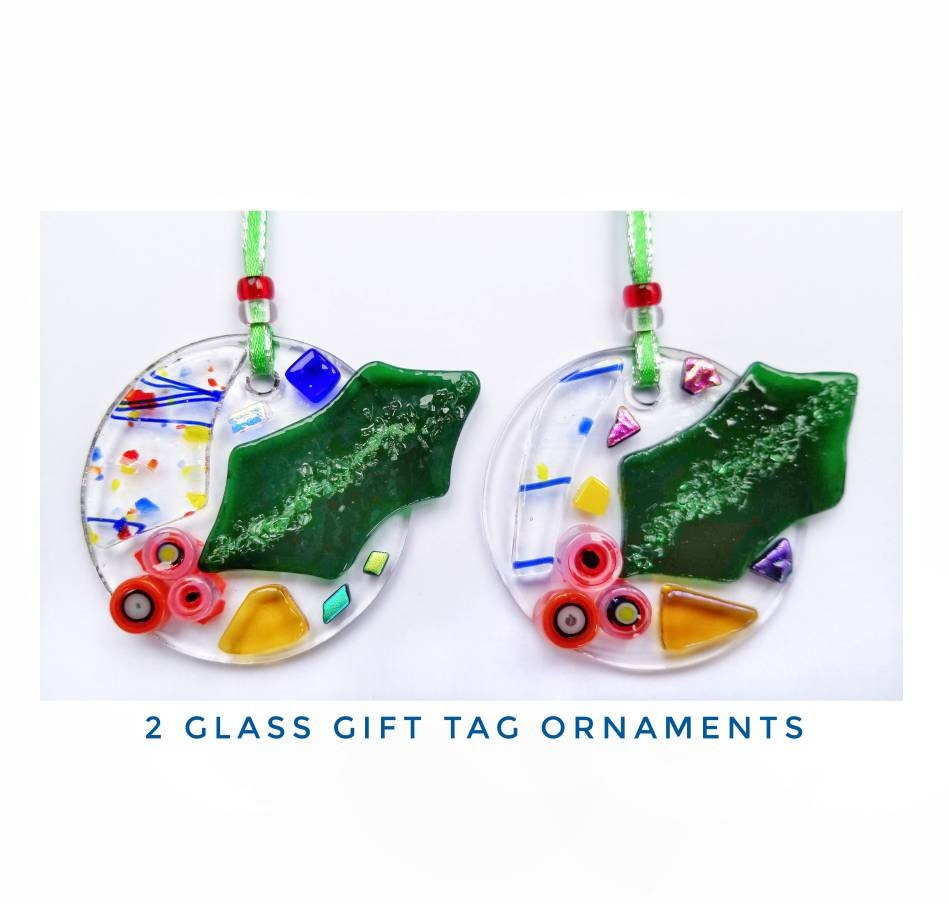 Fused Glass Holiday Ornaments, Gift Tags. Bright Colors with Red & Green Glass are kiln fired and melted onto a two inch clear circle.